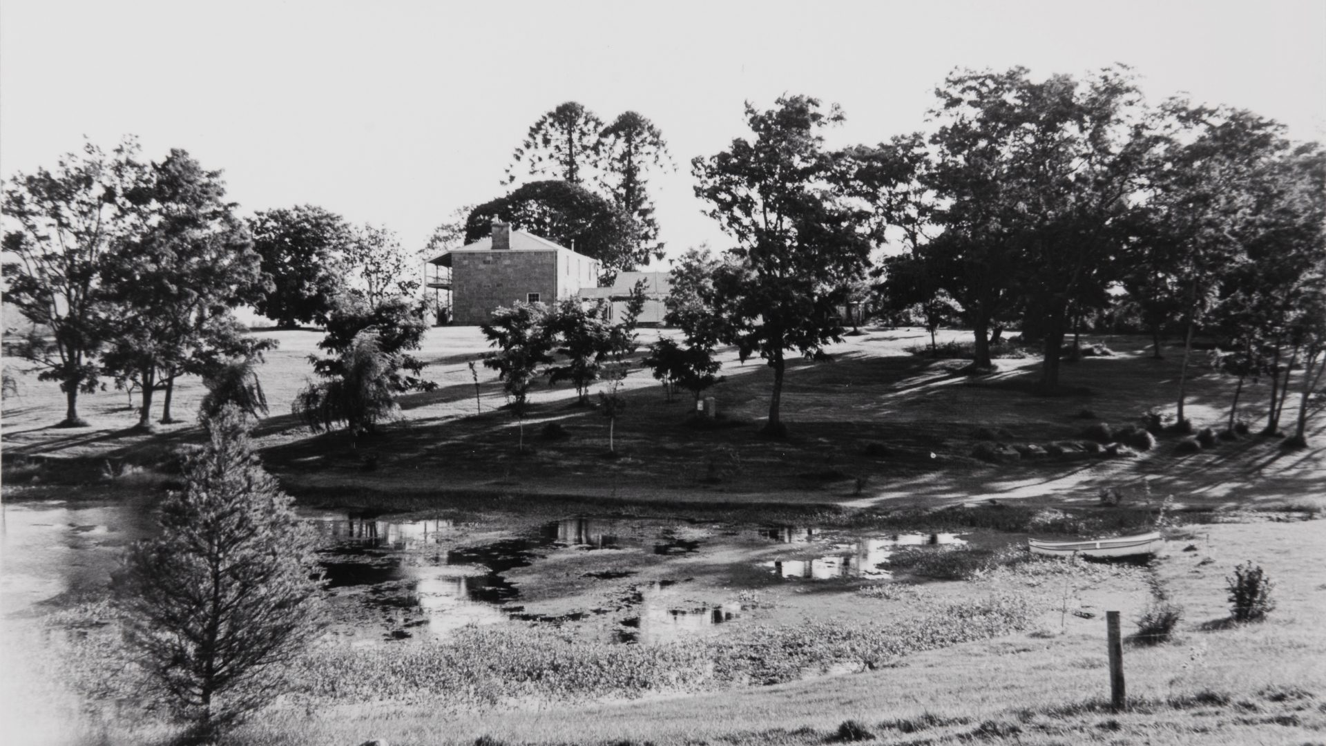 old photo of a two-story sandstone home