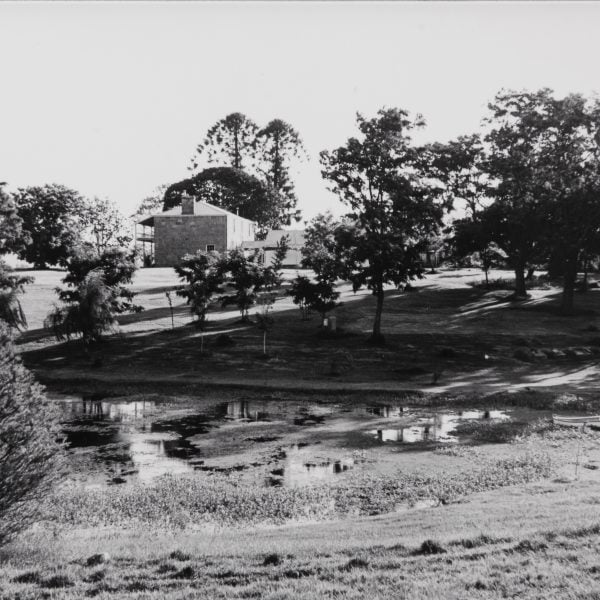 old photo of a two-story sandstone home