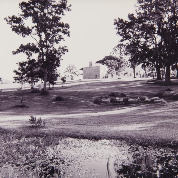 old photo of a two-story sandstone home