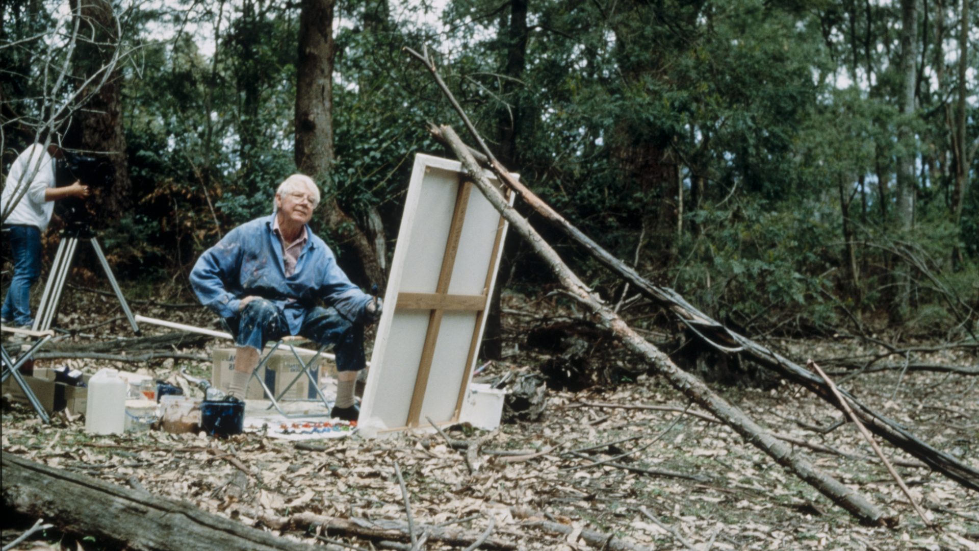 Arthur Boyd painting in on a large canvas in the landscape