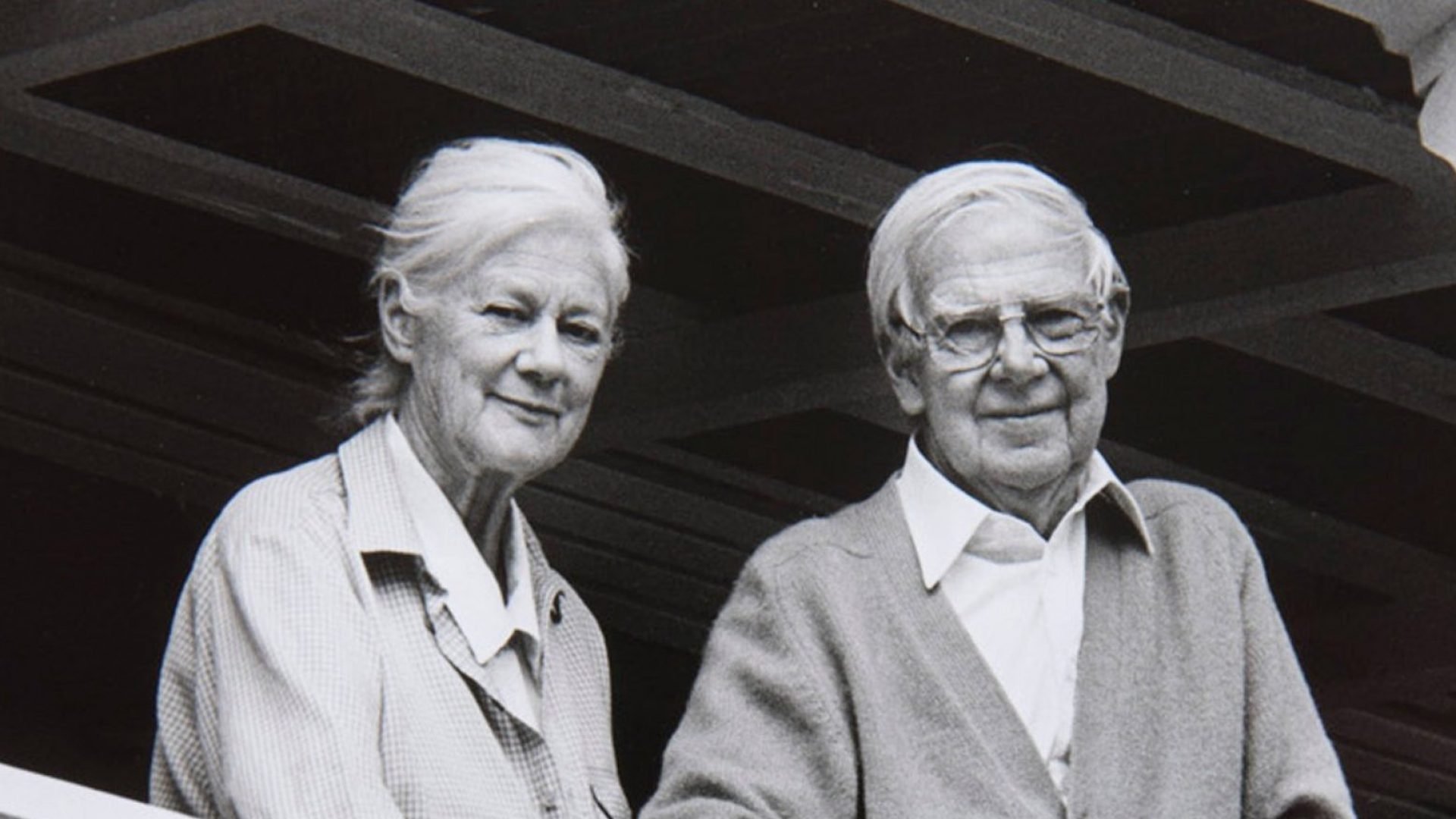 Woman and man standing on a balcony