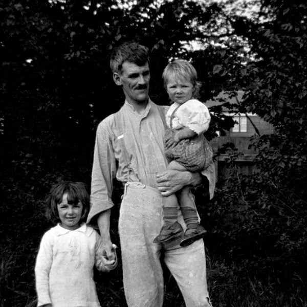Man with two small children