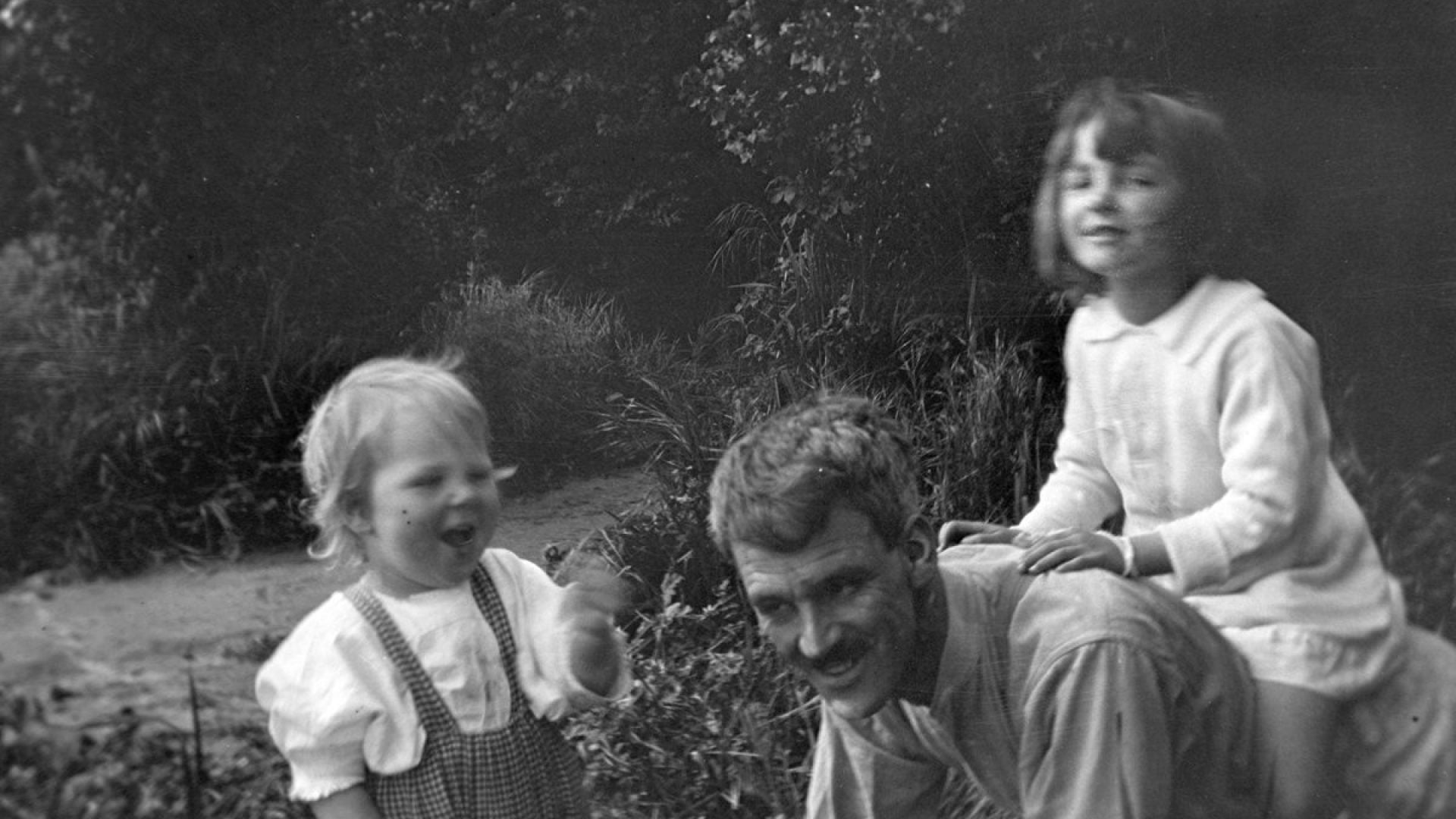 Man playing with two children