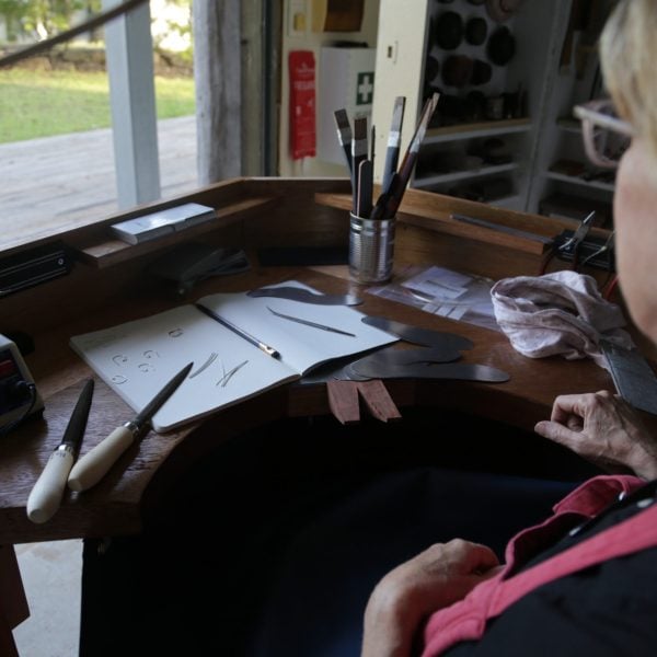 A person sitting at a desk with tools