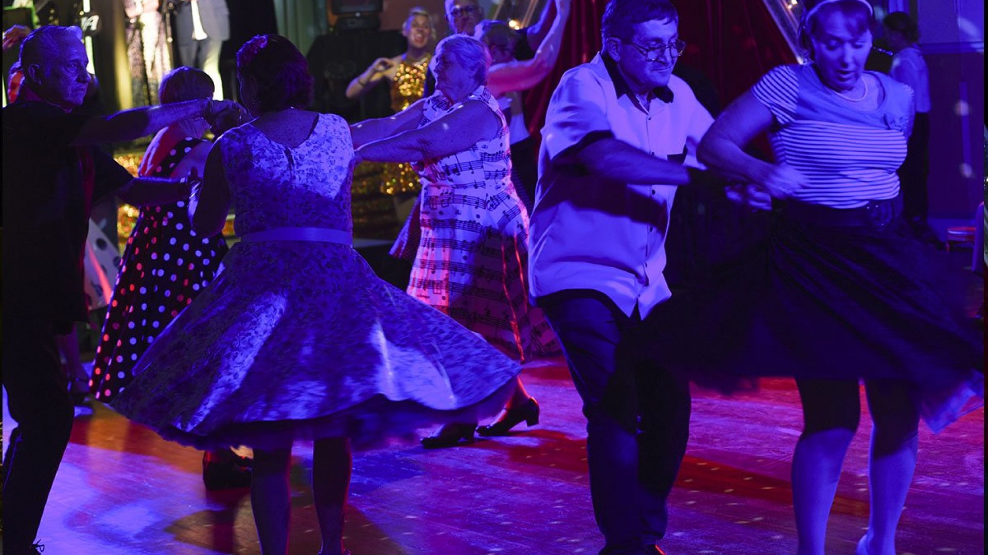 3 couples dancing together