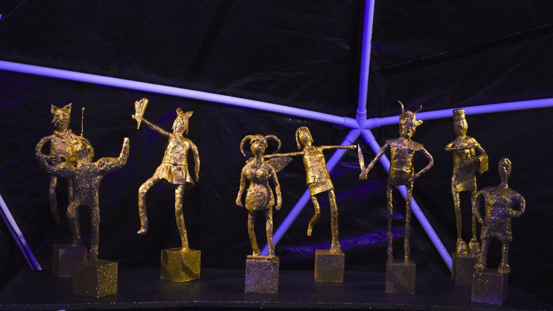 8 small gold abstract figurines