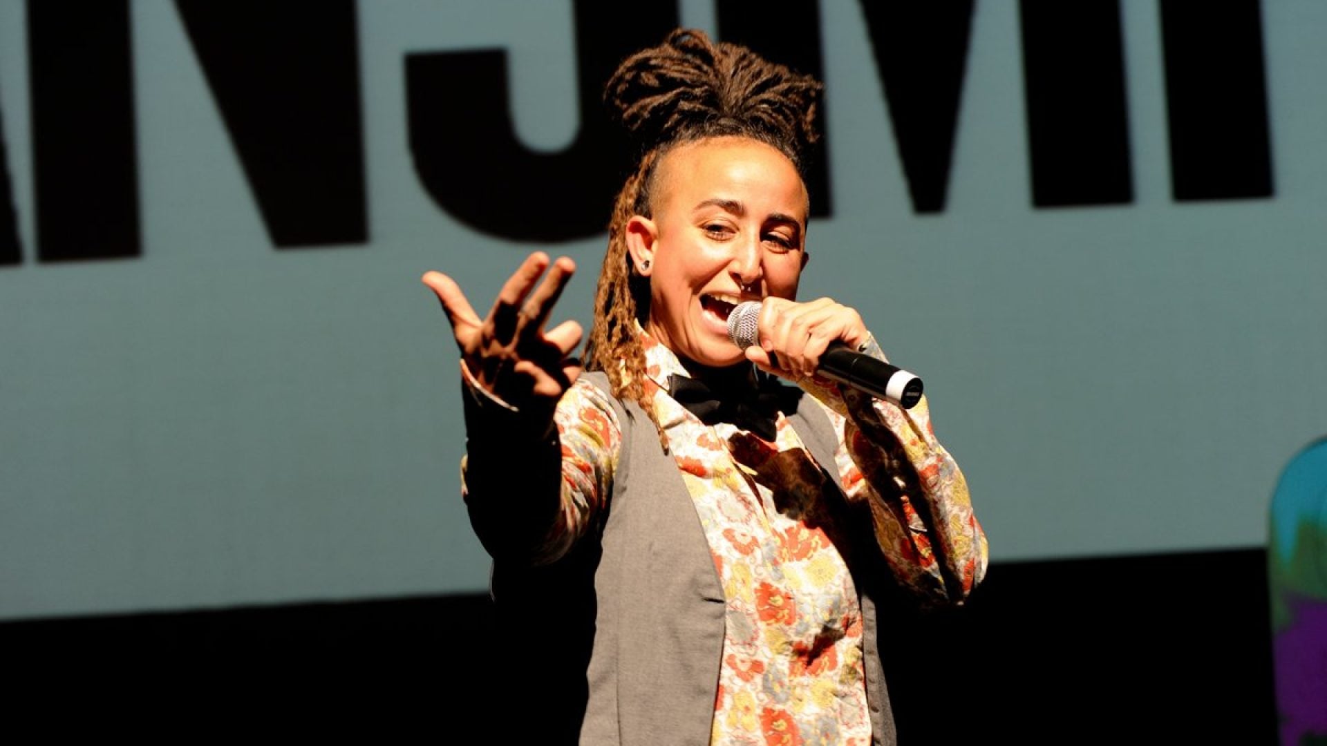 Person singing into a microphone