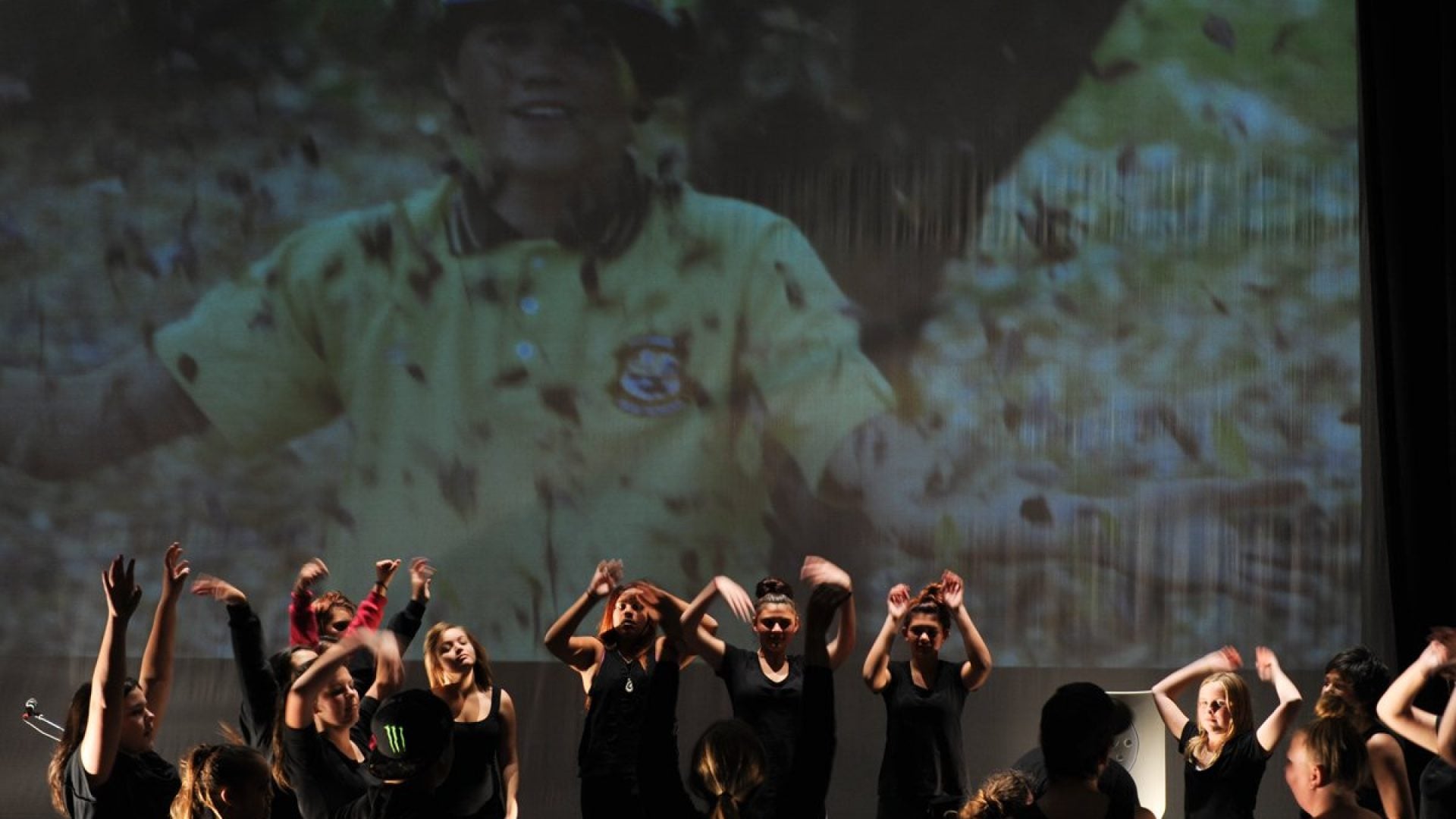10 people dancing freely on stage