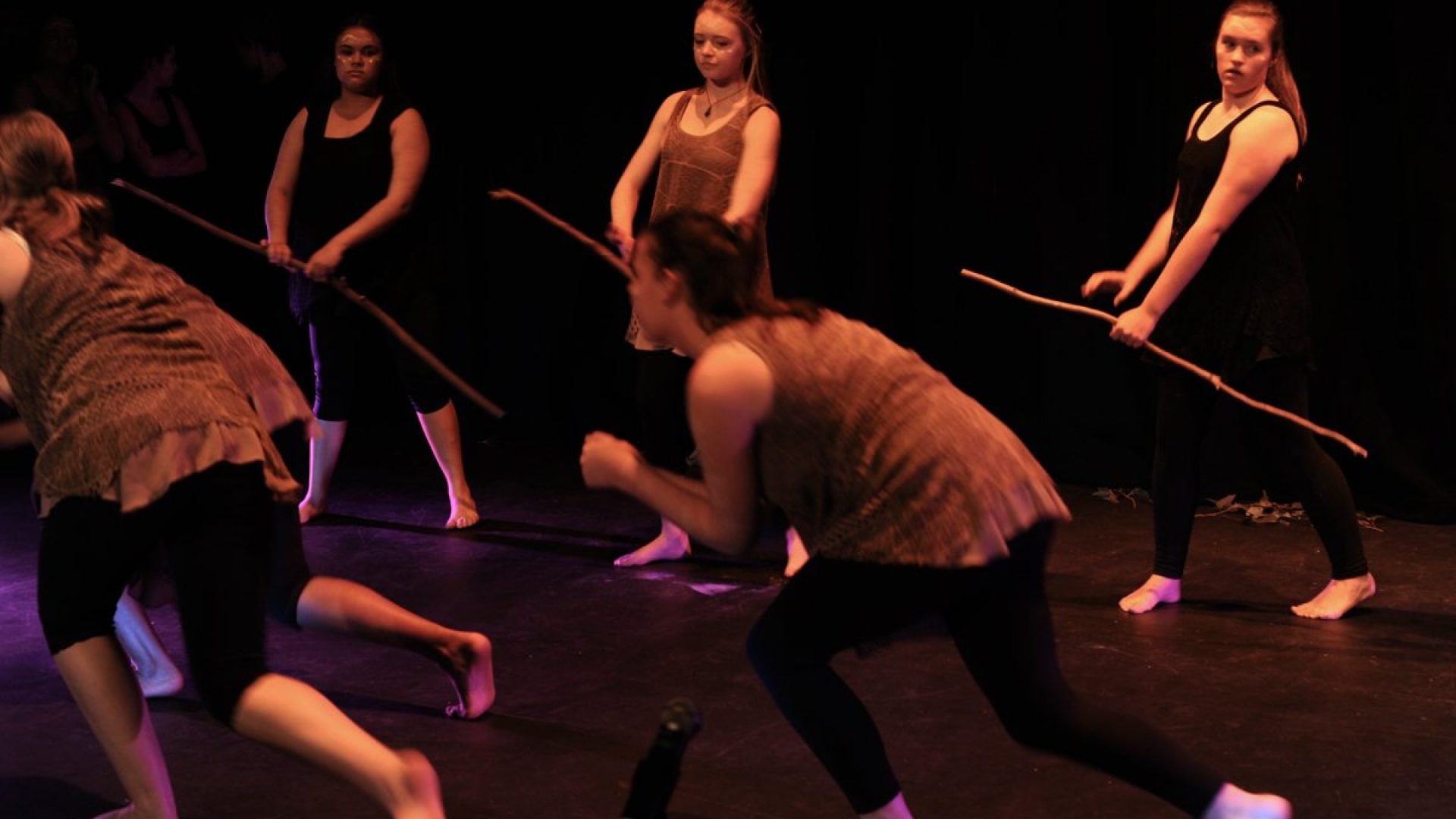 6 girls dancing together on stage