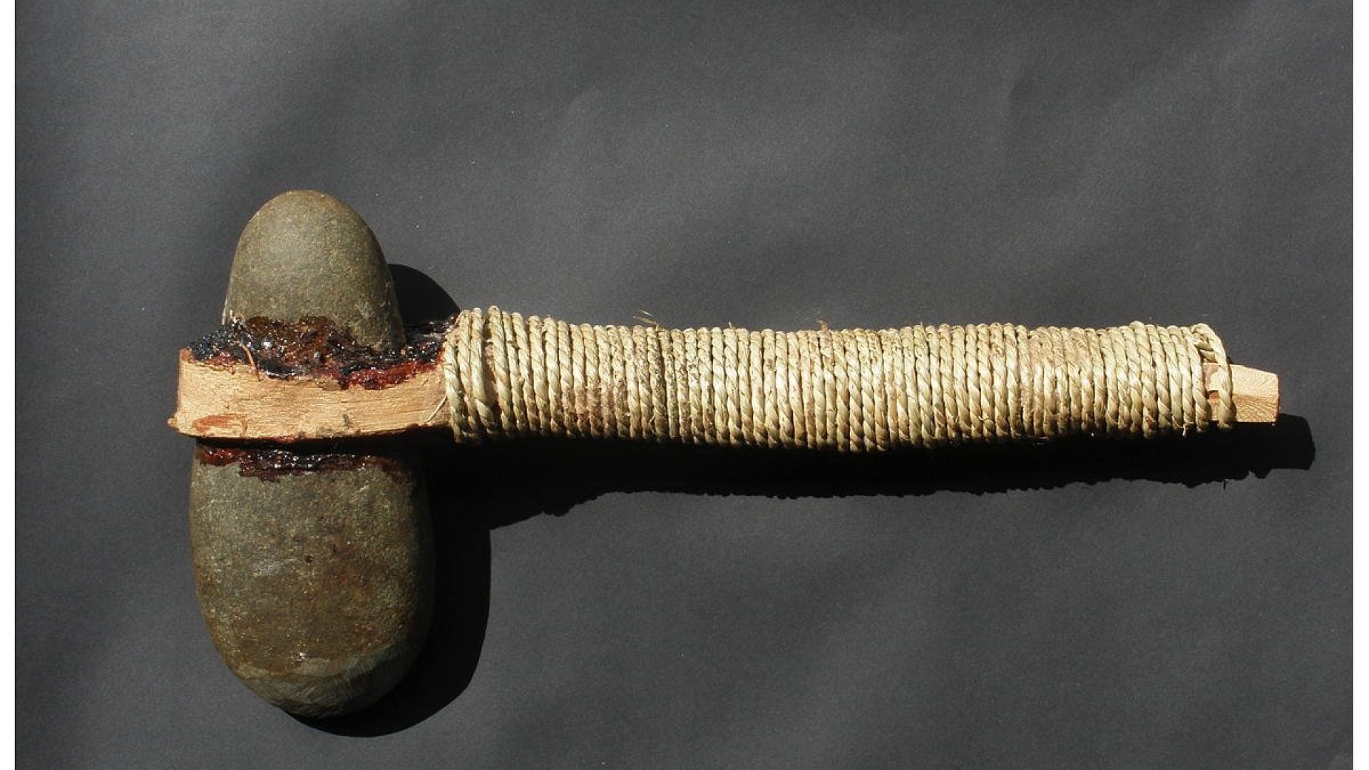 A hammer-like took made from wood, rope and a stone