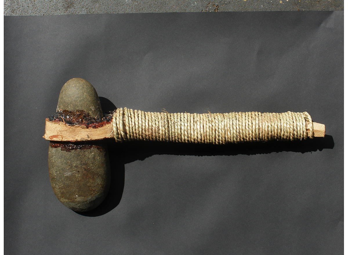 Stone axes, carefully ground to a sharp edge in sandstone grooves. They were hafted to handles with grass tree gum.