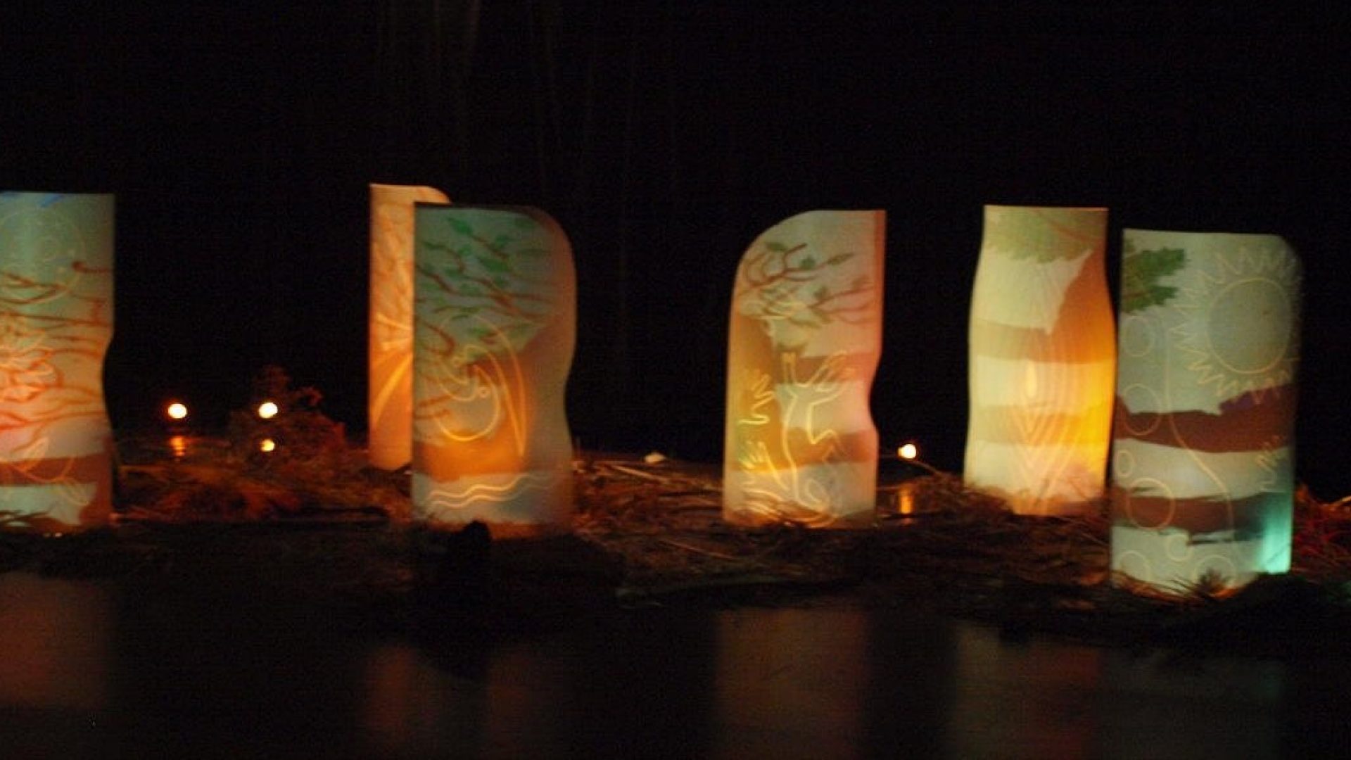 Abstract leave imagery projected on tall white structures
