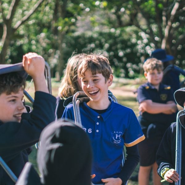 A group of children standing together laughing
