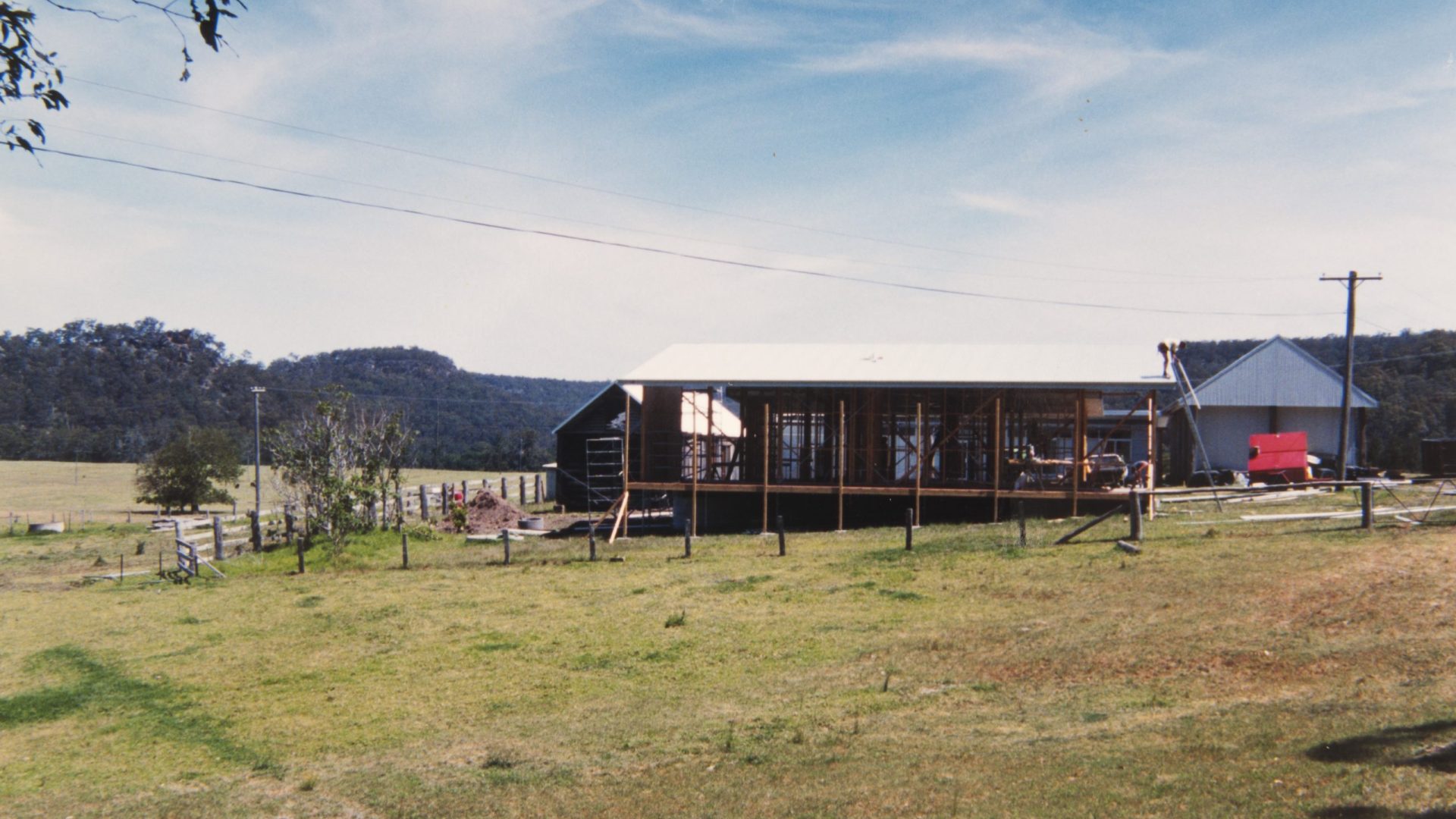 Construction of buildings with mountains in the background