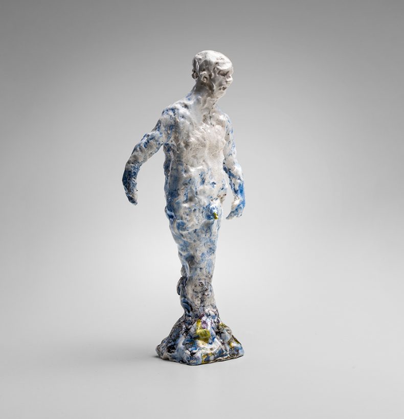 ceramic sculpture of a male figure