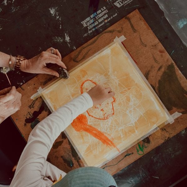 adult and child drawing together