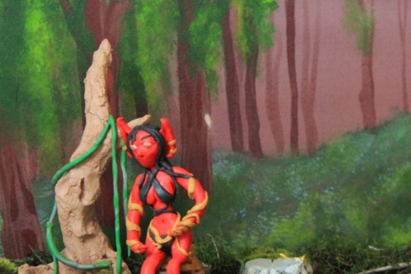 Plasticine figure in forest scene