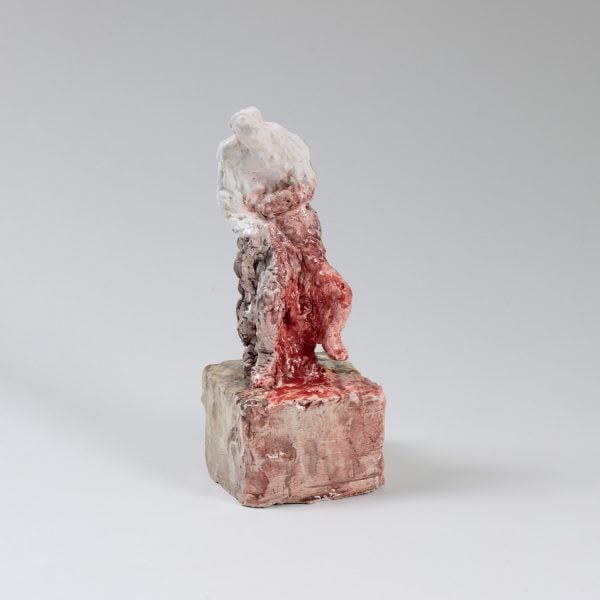 Ceramic figure with white and red glaze