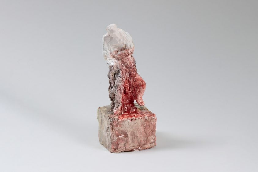 Ceramic figure with white and red glaze