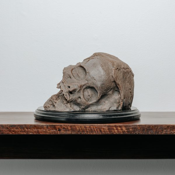 
'Self Portrait as a Mummified Head'(detail) 2021, Resin, recycled timber, ash, human hair, stoneware, reclaimed artificial cemetery flowers, inherited doilies, stainless steel, velvet, acrylic lacquer, wax, 150 x 60 x 28cm. Photo: Lakshal Perera.
