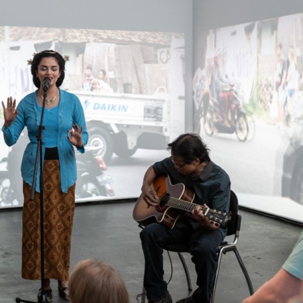 Kartika Suharto-Martin performing as alter ego Siti Suharti, in looking here looking north 2019 exhibition by Woven Kolektif, Casula Powerhouse Arts Centre, Sydney. Photo: Chantel Bann