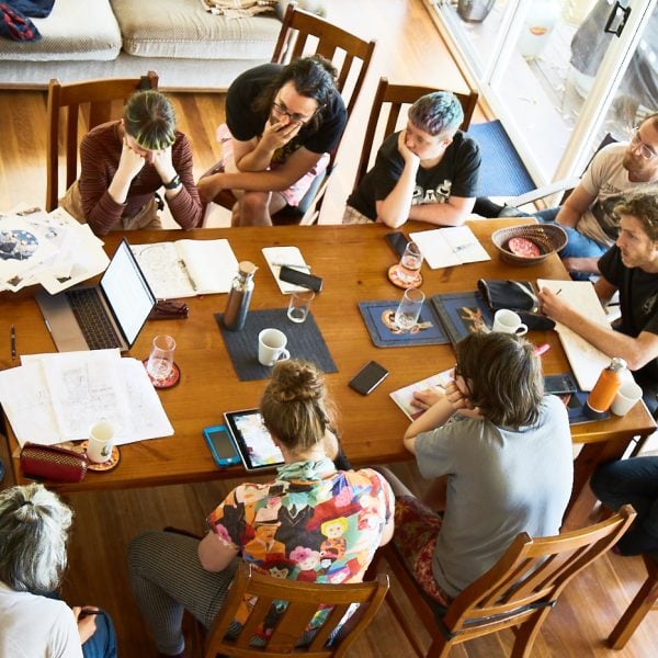 Participants workshopping a book at the Dangar Island residency in 2019. Photo:  Gabe Clark