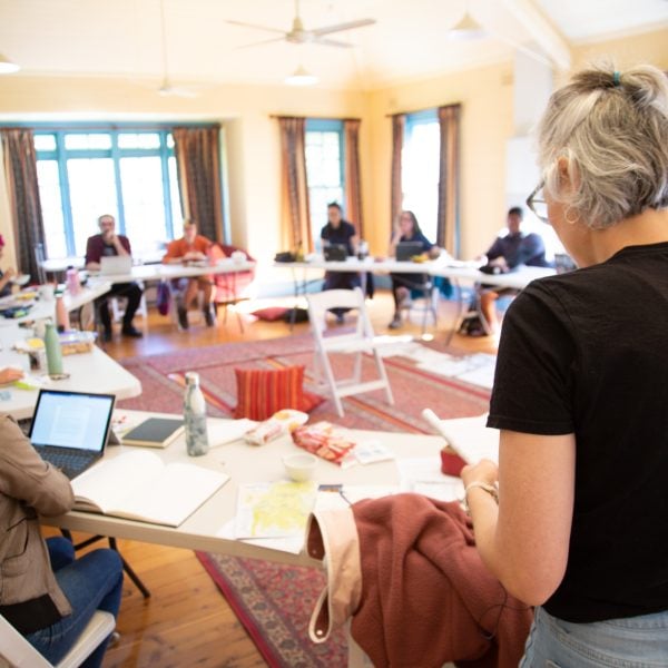 Participants workshopping a book at the Yorangabilly residency in 2022. Photo: Gabe Clark