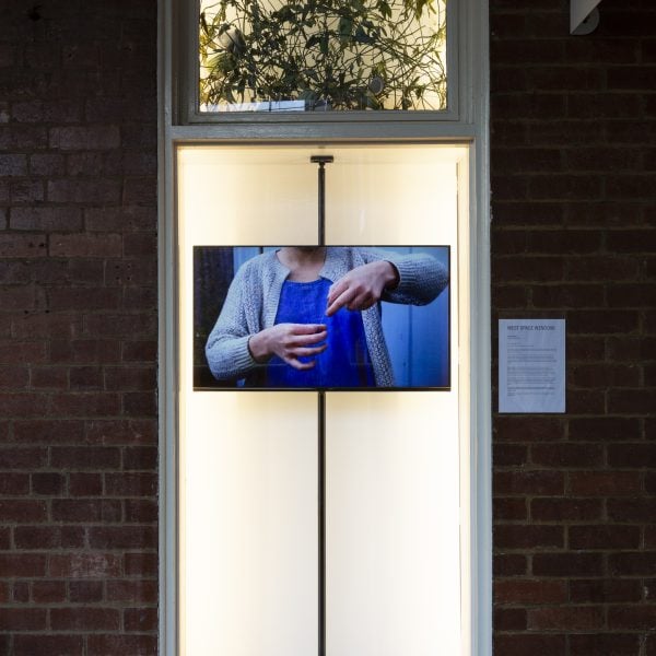Anna Dunnill, 'Processing Plant' 2022, video with sound, moth vine, moth vine fibre. Videography by Jess Cockerill. 
Installation view, West Space Window. Photo: Janelle Low.