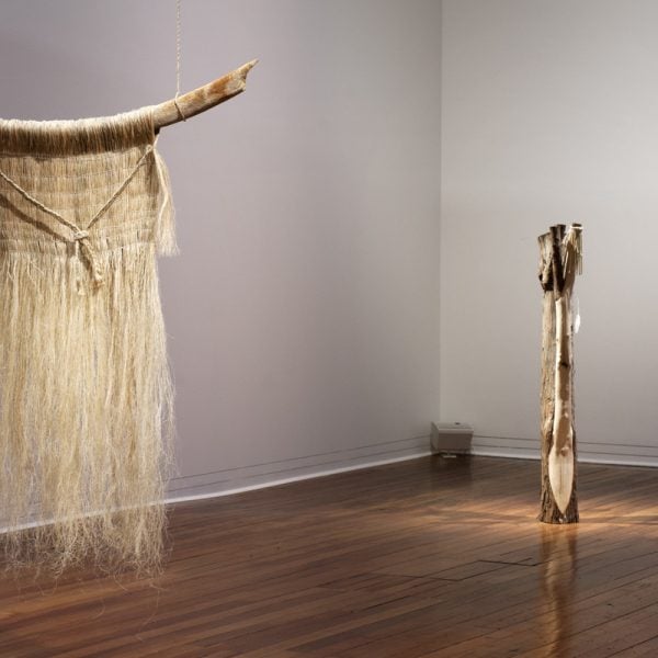 Madison Kelly and Mya Morrison-Middleton, Tūtakitaka (2021). Tohorā rara (Southern Right Whale rib), milled harakeke fibre, whītau (Makaweroa, Ruapani, no.88), glass beads, tōtara, feathers, seaglass, two channel audio track. Photo credit: Dunedin Public Art Gallery