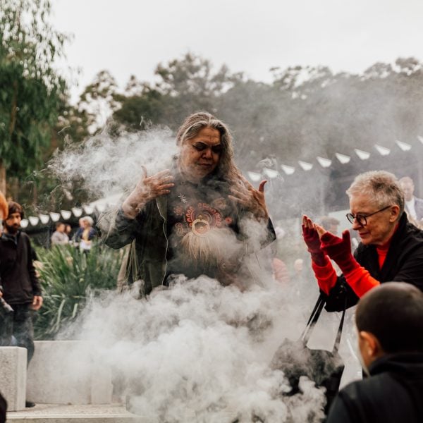 People bathe in smoke during a smoking ceremony