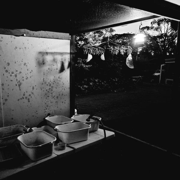 Cyanotype washing outside studio at night, Photo: LeAnne Vincent