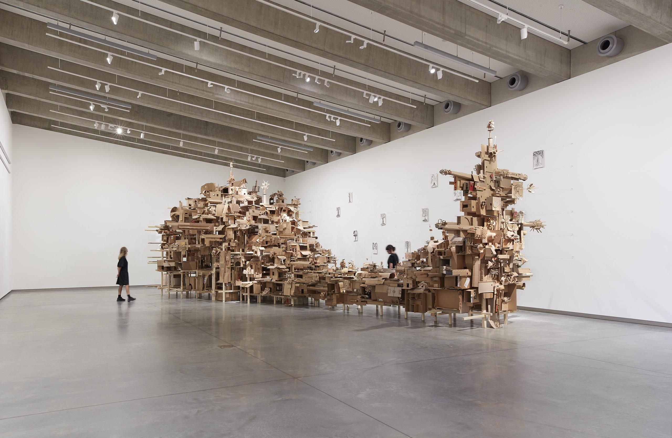 Isabel & Alfredo Aquilizan, REFLECTIONS / HABITATIONS, 2025, laminated pine timber, steel cable, screws, cardboard, paper, aquarelle watercolour pens, glue, paper tape. Courtesy of the artist. Photo by Zan Wimberley.  