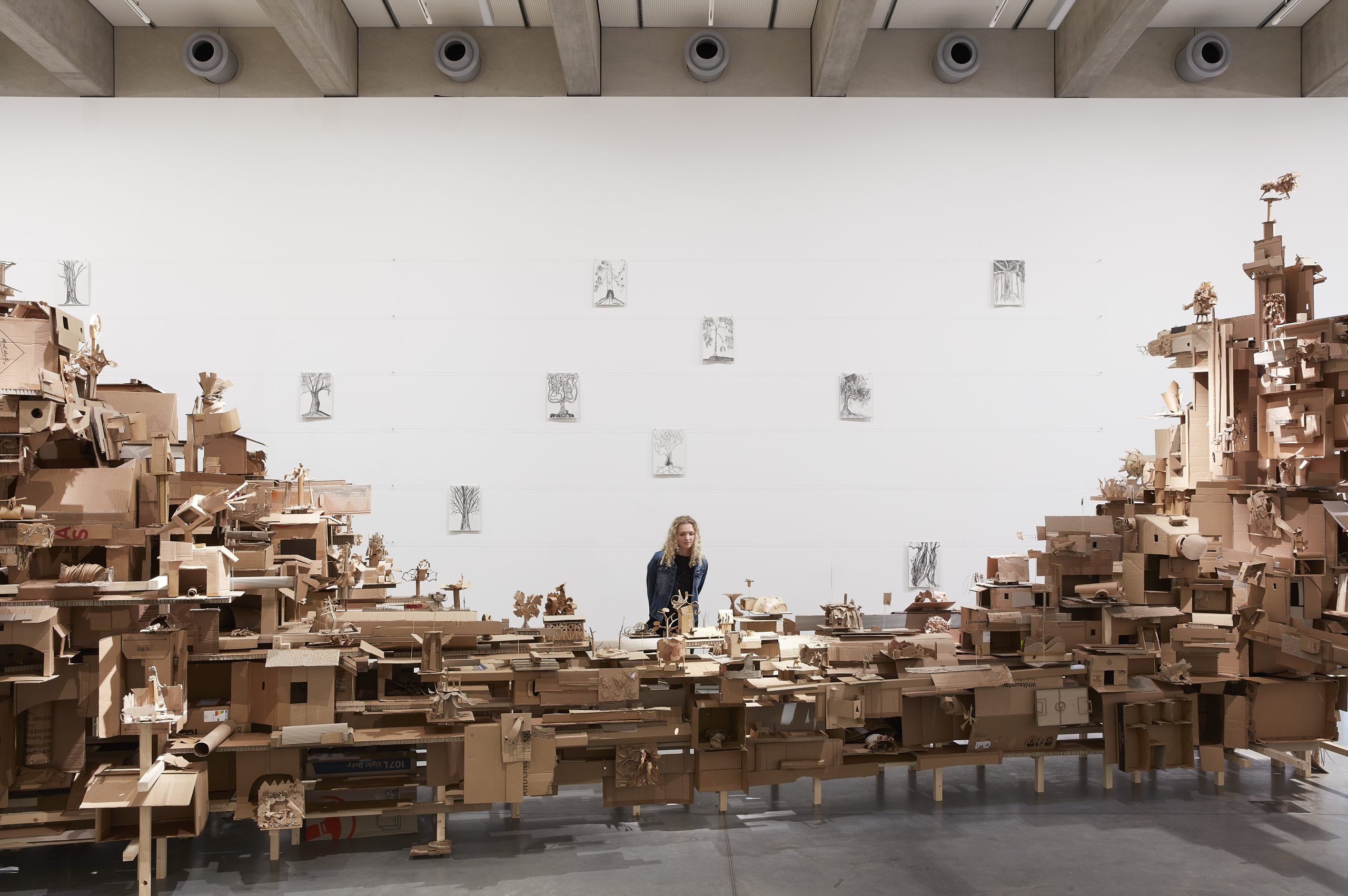 Isabel & Alfredo Aquilizan, REFLECTIONS / HABITATIONS, 2025, laminated pine timber, steel cable, screws, cardboard, paper, aquarelle watercolour pens, glue, paper tape. Courtesy of the artist. Photo by Zan Wimberley.  