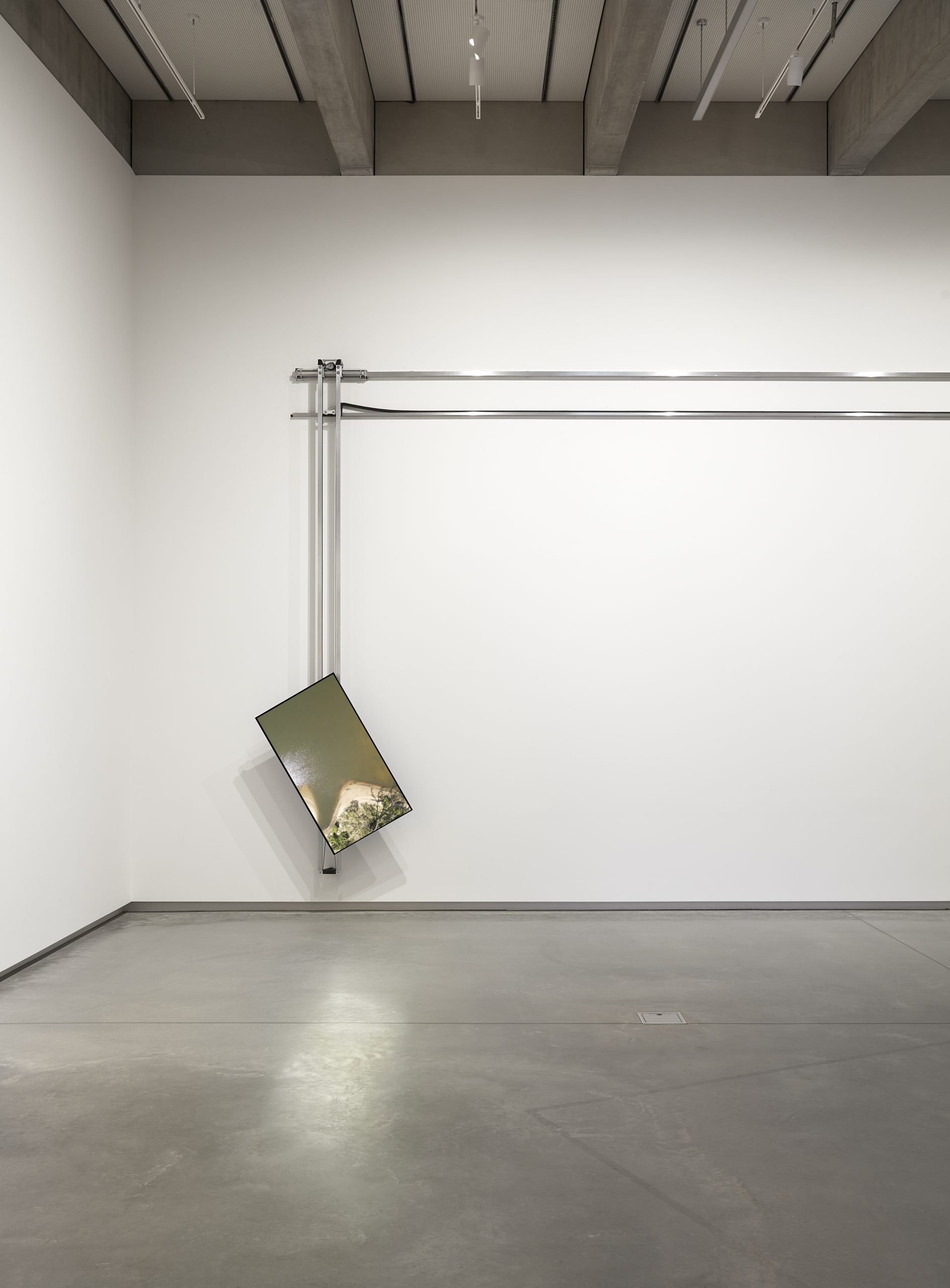 Robert Andrew , new eyes — old Country, 2025 , charcoal pieces, electromechanical devices, aluminium components, video footage & monitor. Courtesy of the artist. Photo by Zan Wimberley.