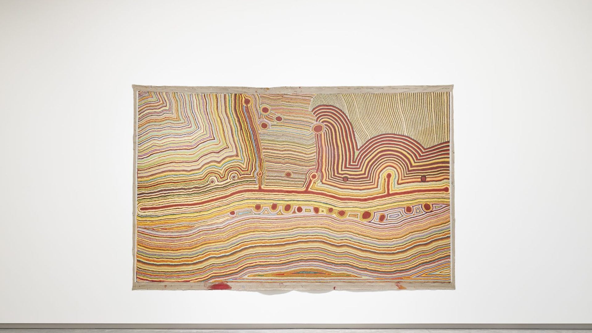 First Nations Australian artwork in warm colours
