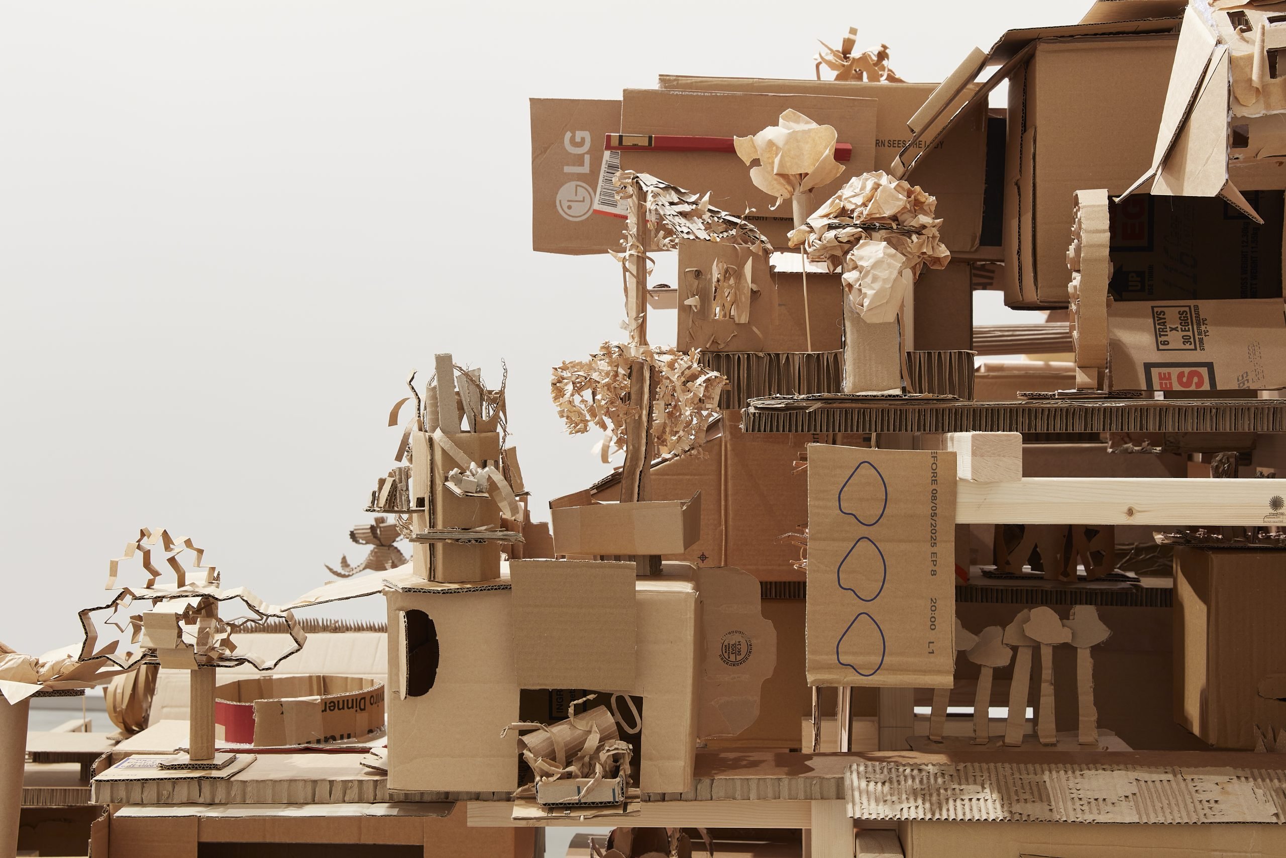 Isabel & Alfredo Aquilizan, REFLECTIONS / HABITATIONS, 2025, laminated pine timber, steel cable, screws, cardboard, paper, aquarelle watercolour pens, glue, paper tape. Courtesy of the artist. Photo by Zan Wimberley.  