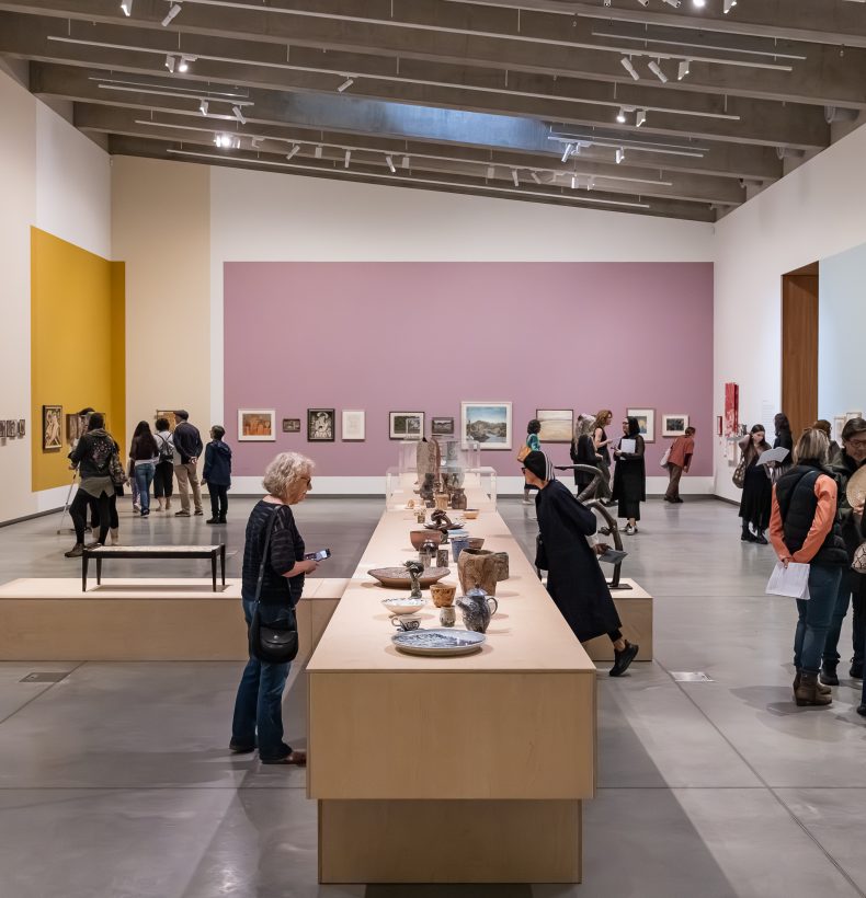 Exhibition space with people viewing art