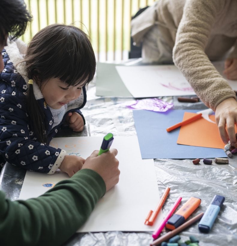 Child drawing in workshop