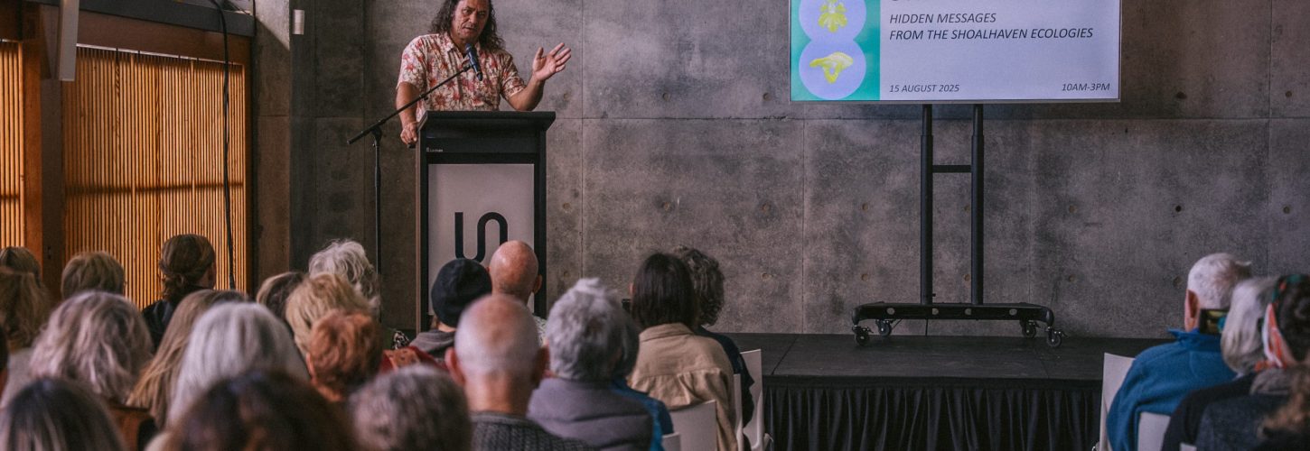 Person speaking at science symposium event.