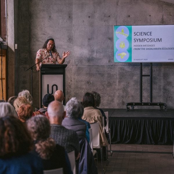 Person speaking at science symposium event.