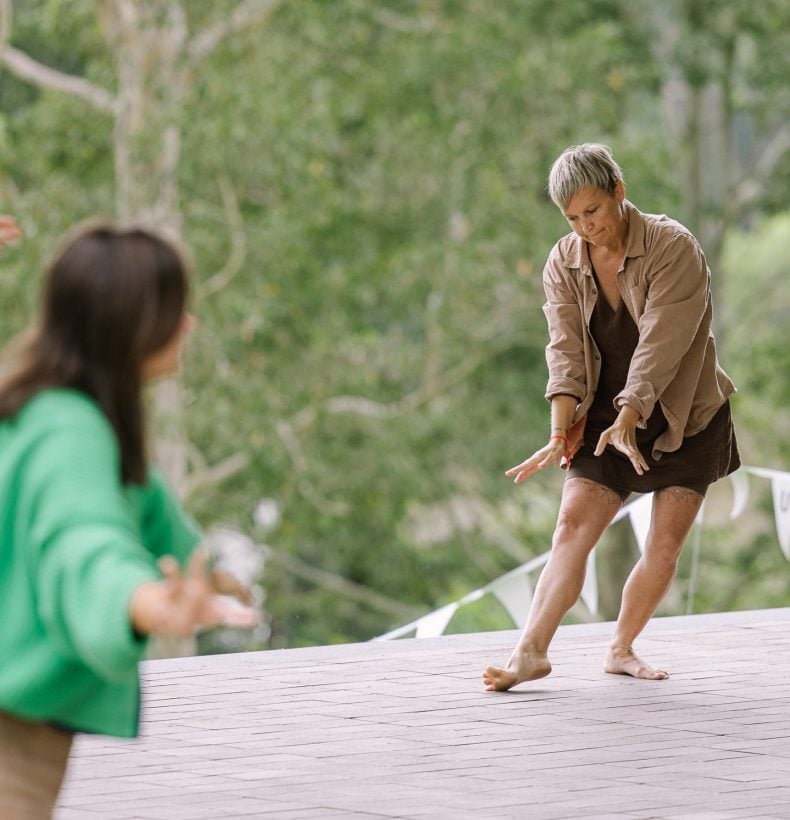 Humans moving together outside.