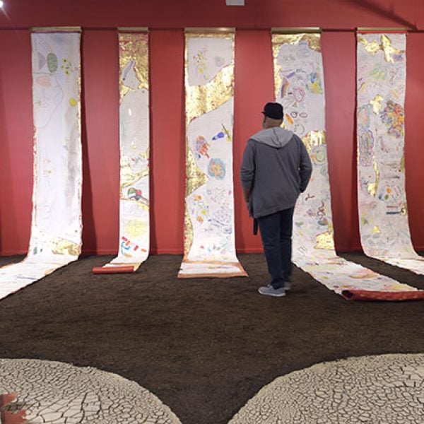 Azza Zein, Periplus, Tashabok, 2024, collaborative drawings scrolls, textile, mounted with brass. Photo: Carla Gottgens
