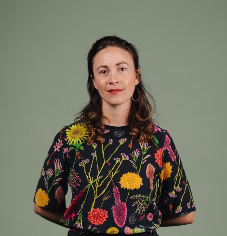 Studio photo of a person on a green background.