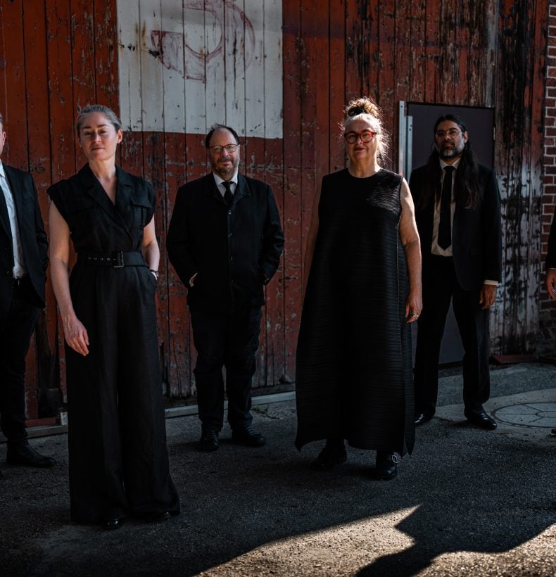 Group of people standing for photo.