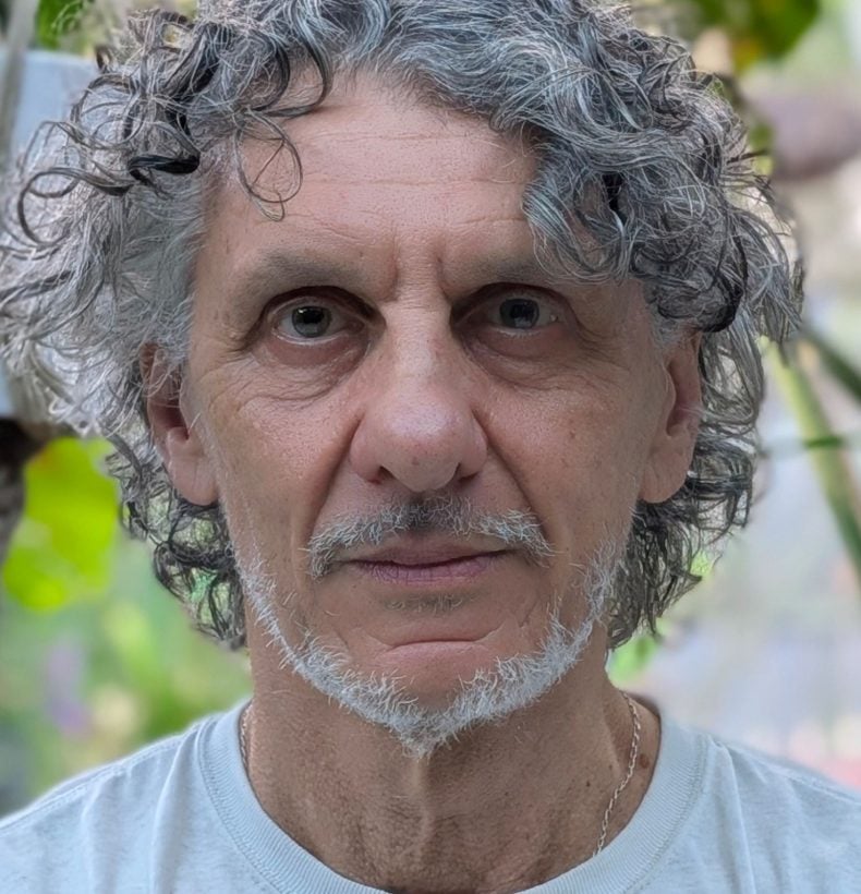 Headshot of a man with grey hair, moustache and beard.
