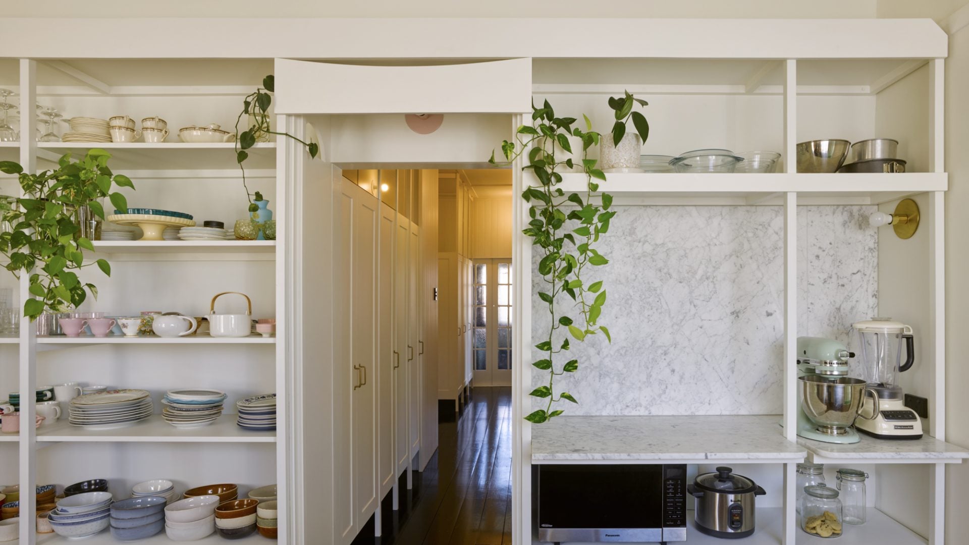 Interior of a hallway from a kitchen