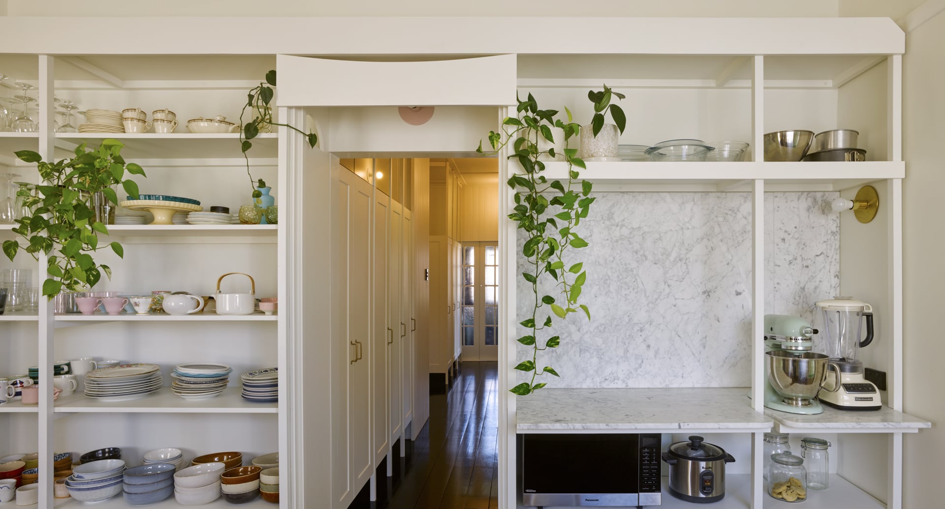Interior of a hallway from a kitchen
