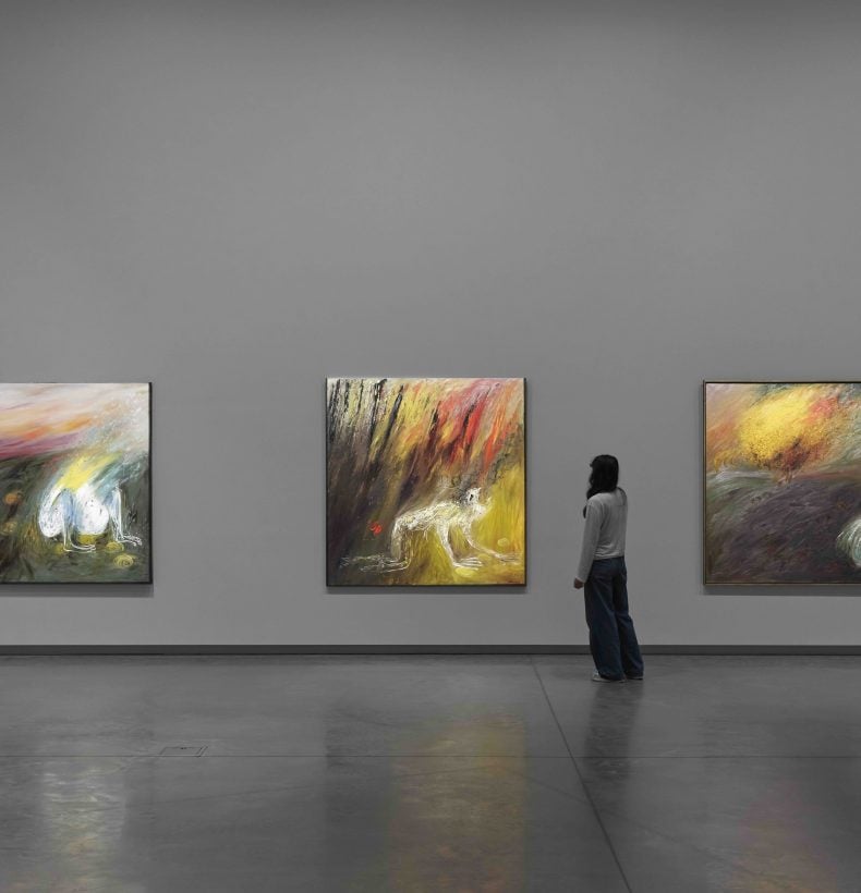 Exhibition display with person viewing work.