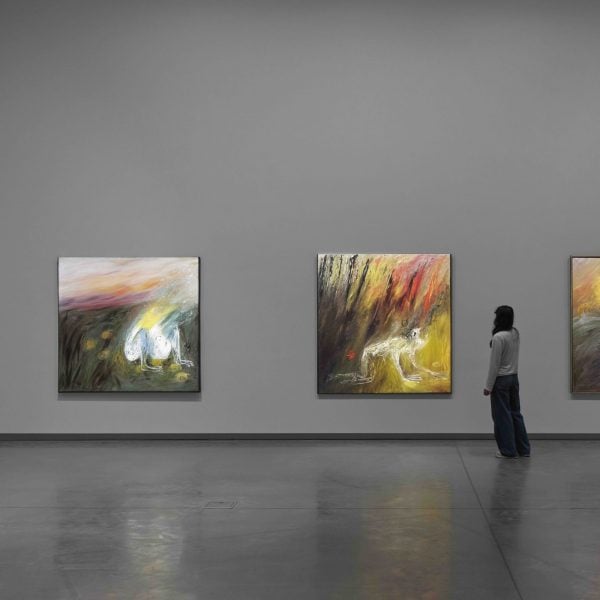 Exhibition display with person viewing work.