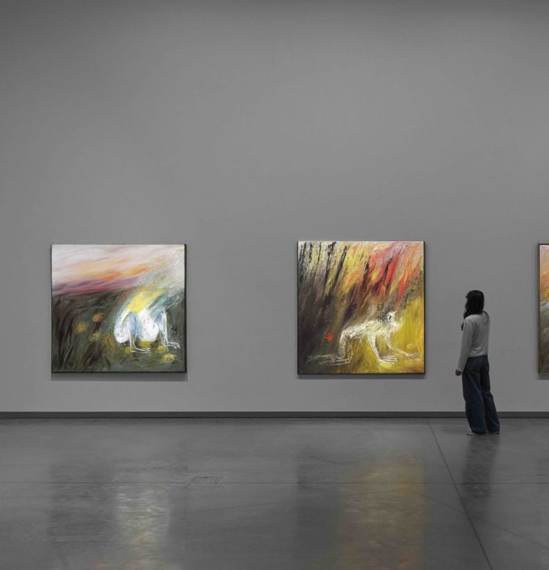 Exhibition display with person viewing work.